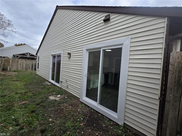 view of property exterior featuring a yard