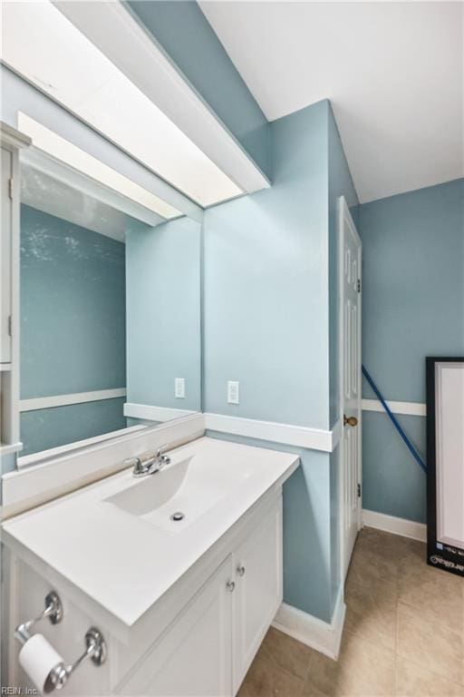 bathroom featuring tile patterned floors and vanity