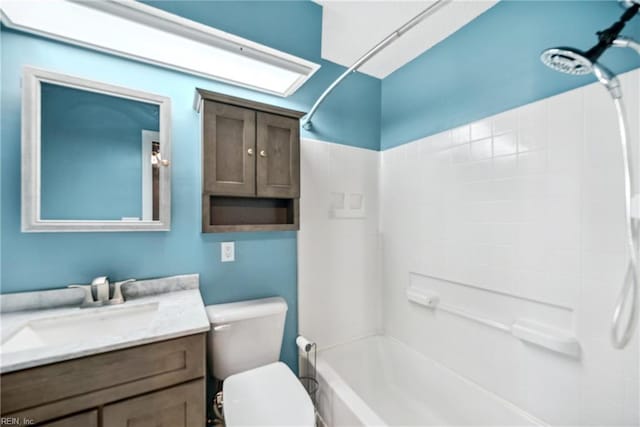 full bathroom featuring vanity, tub / shower combination, and toilet