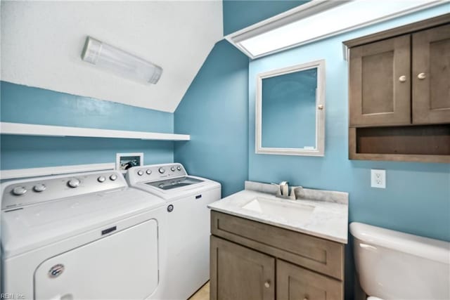 washroom featuring sink and washer and clothes dryer