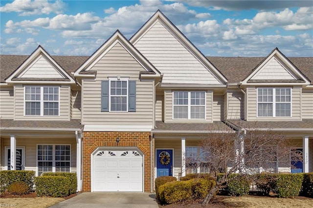 townhome / multi-family property featuring a garage