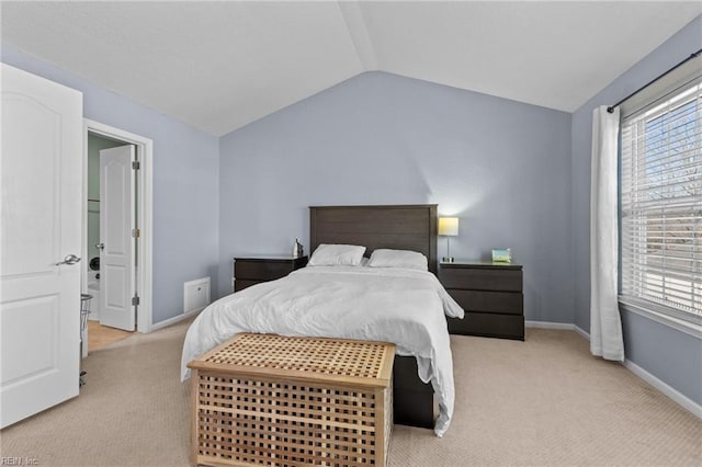 carpeted bedroom featuring lofted ceiling