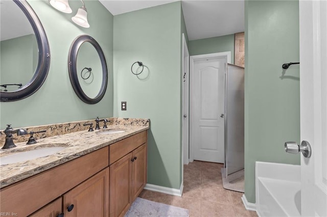 bathroom with tile patterned floors, vanity, and a washtub