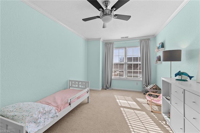 bedroom with light carpet, crown molding, and ceiling fan