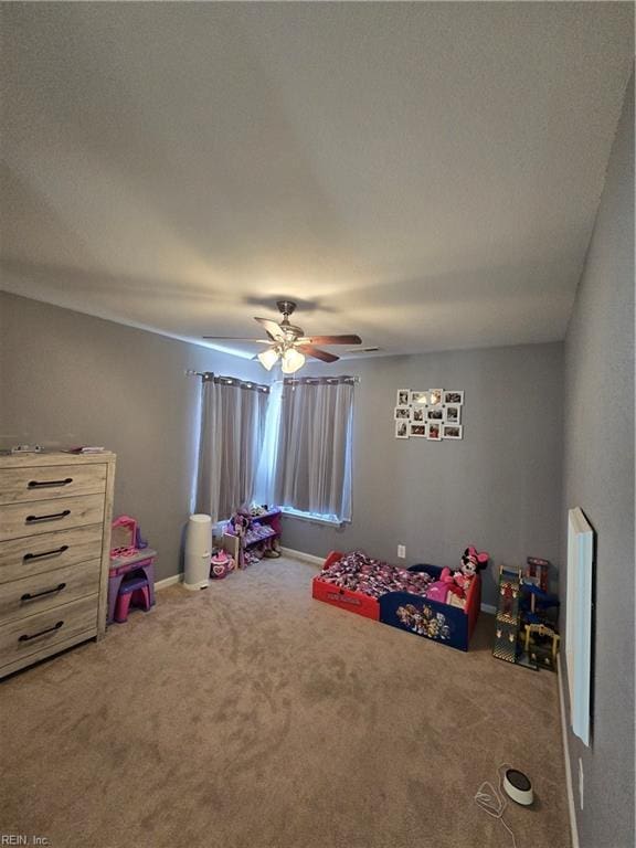 rec room featuring carpet and ceiling fan