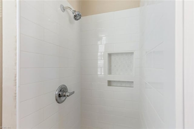 details with a tile shower