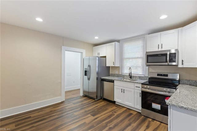 kitchen featuring sink, white cabinets, and appliances with stainless steel finishes