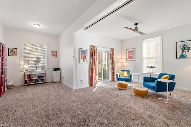 sitting room featuring carpet, a wealth of natural light, and ceiling fan