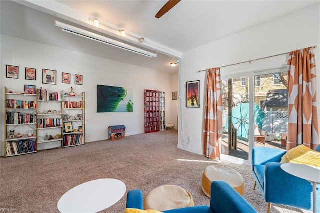 recreation room featuring ceiling fan and carpet