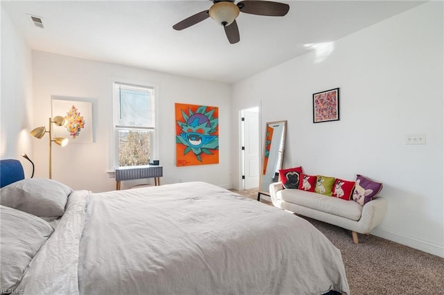 bedroom with ceiling fan and carpet flooring