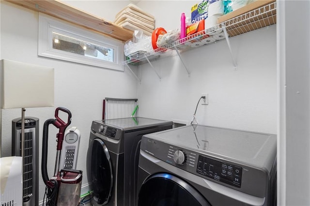 clothes washing area featuring washing machine and clothes dryer