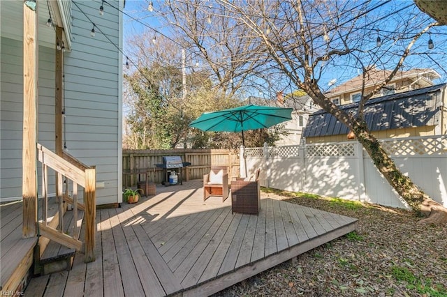 deck featuring a grill and an outdoor living space