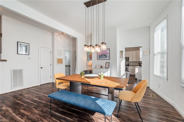 dining area with dark hardwood / wood-style floors