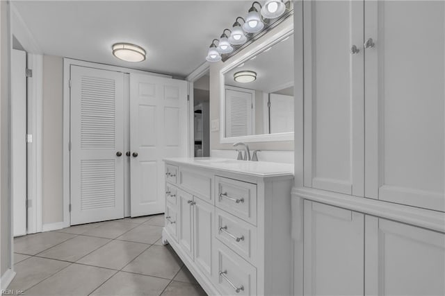 bathroom with tile patterned floors and vanity