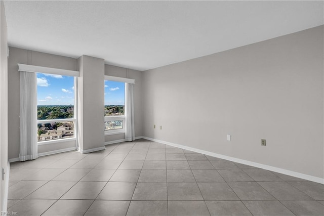 unfurnished room featuring light tile patterned flooring