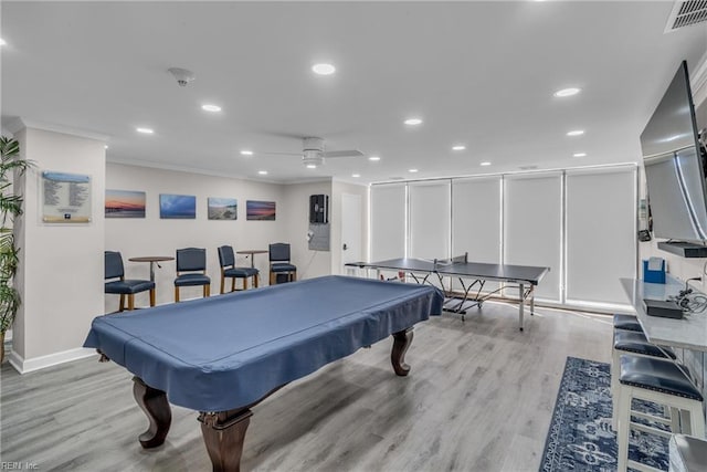 game room with crown molding, pool table, ceiling fan, and light wood-type flooring