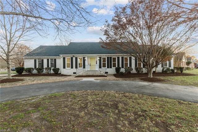 ranch-style house with a front lawn