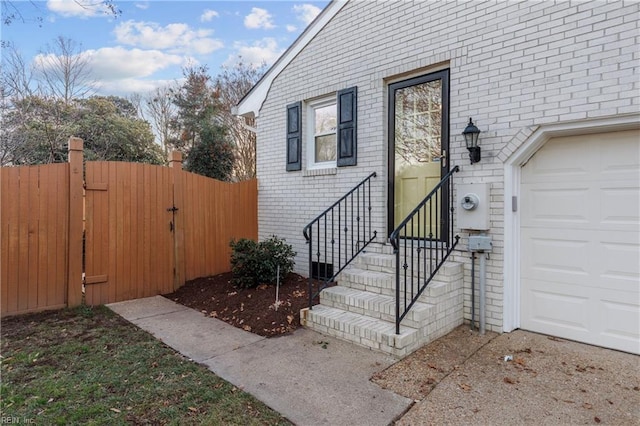 doorway to property featuring a garage