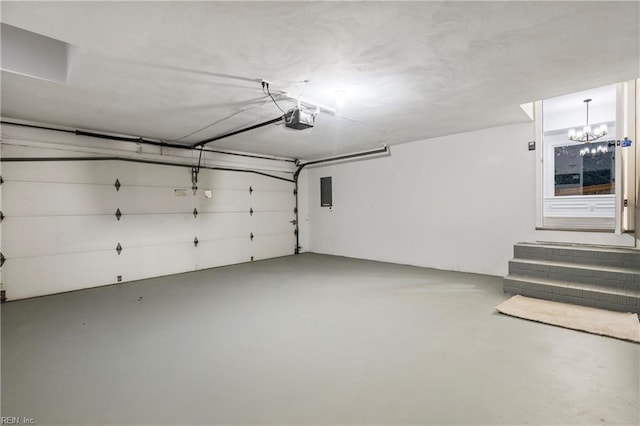 garage with a garage door opener and electric panel