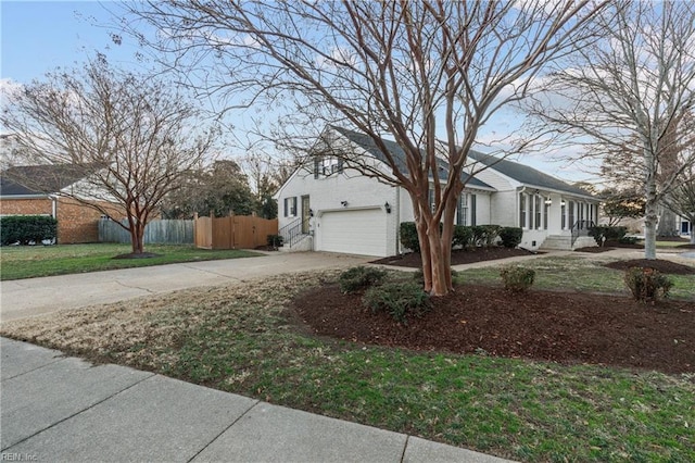 view of side of property with a garage and a yard