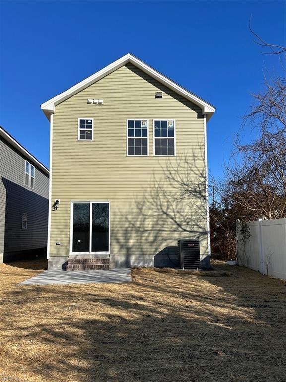 rear view of house with a patio and central air condition unit