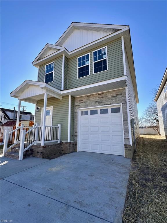 view of front of house featuring a garage and covered porch