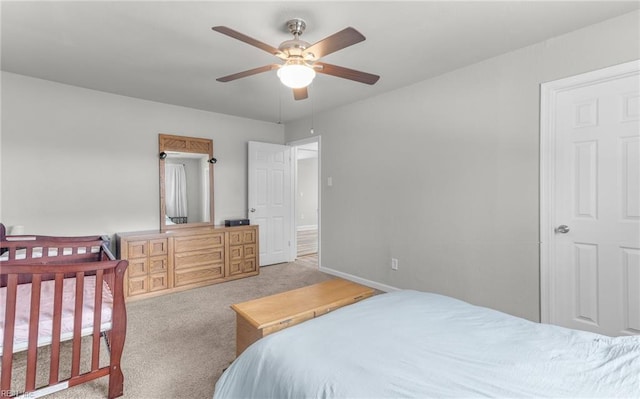 bedroom featuring ceiling fan and light carpet