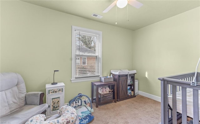 bedroom with ceiling fan and light colored carpet