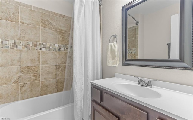 bathroom with vanity and shower / bath combo