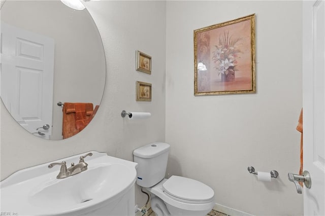 bathroom with sink and toilet