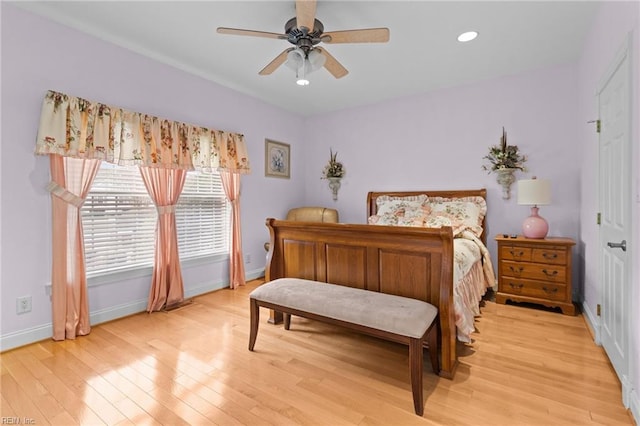 bedroom with light hardwood / wood-style flooring and ceiling fan