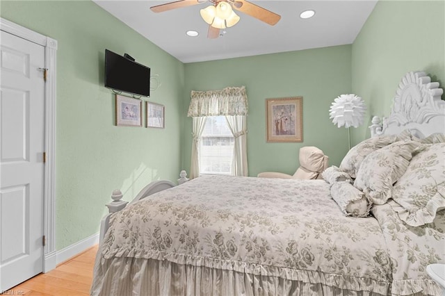 bedroom featuring ceiling fan and wood-type flooring