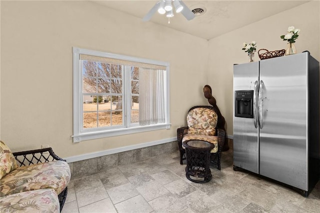 living area featuring ceiling fan