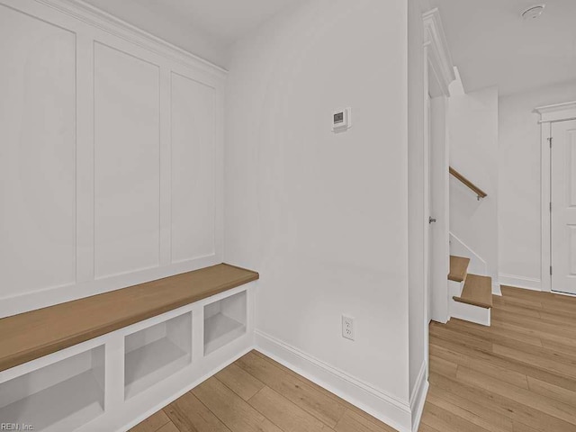 mudroom with light hardwood / wood-style floors