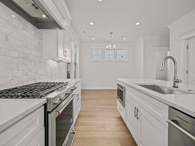 kitchen with sink, ornamental molding, custom range hood, stainless steel appliances, and white cabinets