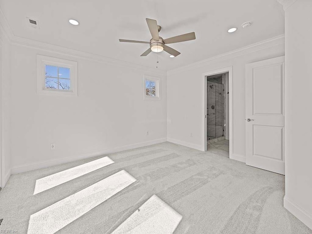 spare room with ornamental molding, light carpet, and ceiling fan