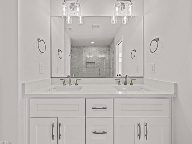 bathroom with an enclosed shower and vanity