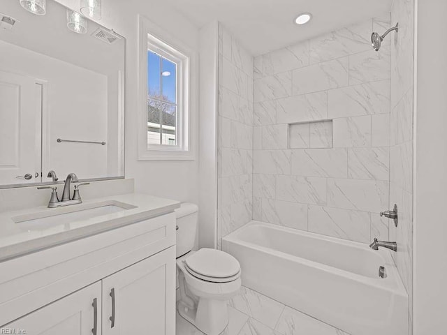 full bathroom featuring vanity, toilet, and tiled shower / bath combo