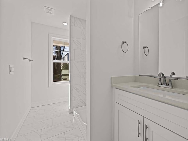 bathroom featuring vanity and walk in shower