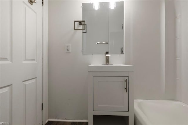 bathroom featuring vanity and a bathtub