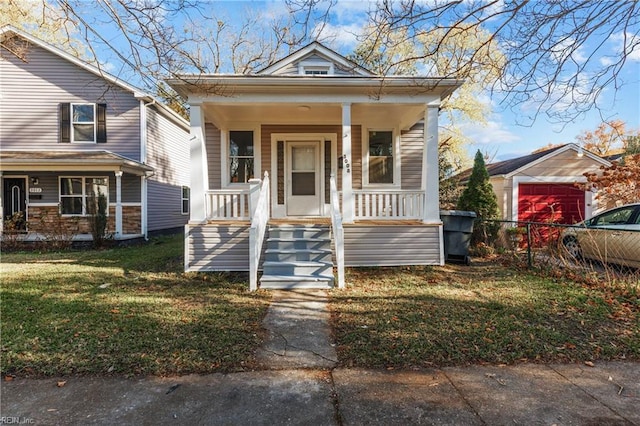 bungalow-style home featuring a porch and a front yard