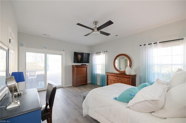 bedroom with hardwood / wood-style floors and ceiling fan