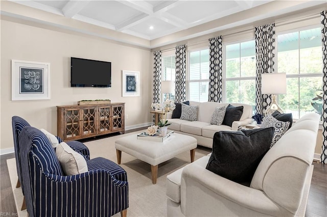 living room featuring coffered ceiling, a healthy amount of sunlight, wood-type flooring, and beamed ceiling