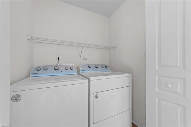 laundry room featuring washing machine and dryer