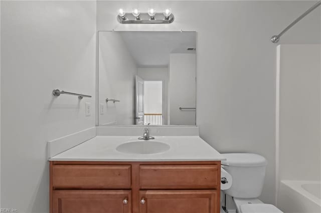 full bathroom featuring vanity,  shower combination, and toilet