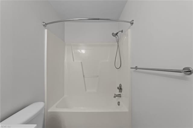 bathroom with toilet and shower / bath combination