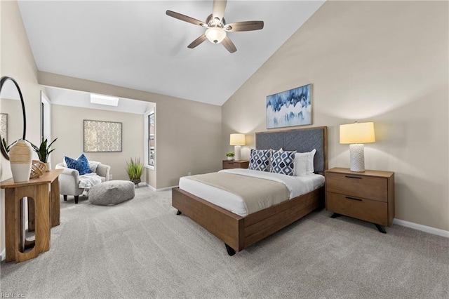 carpeted bedroom featuring high vaulted ceiling and ceiling fan