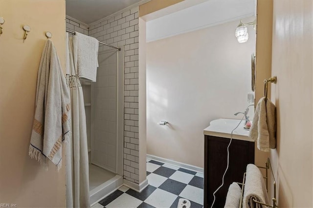 bathroom with vanity and a tile shower