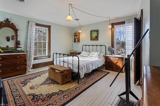 bedroom with hardwood / wood-style floors