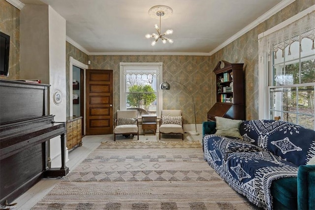 sitting room with ornamental molding and a chandelier